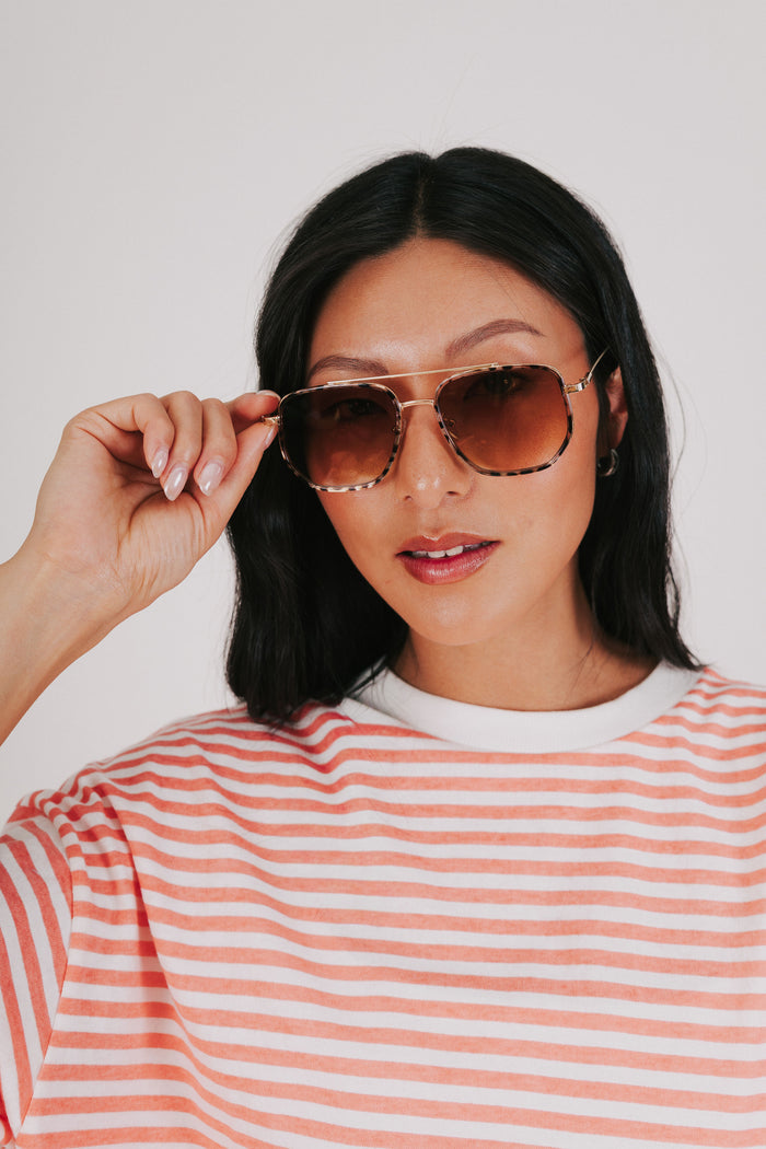 brown and gold aviator sunglasses