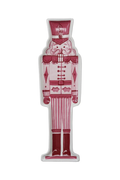 Decorative nutcracker shaped plate with pink, red, and white color pallet.