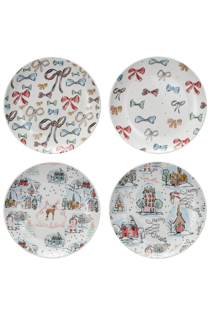 Set of four decorative plates with festive designs on a white background