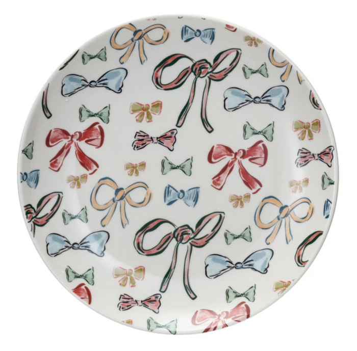 Round plate with colorful bow pattern on a white background