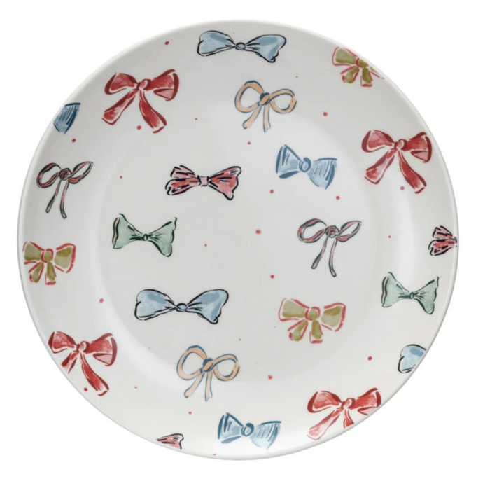 Decorative plate with colorful bow patterns on a white background