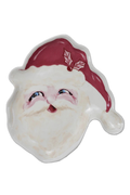 Decorative plate with a face of Santa Claus wearing a red hat on a white background