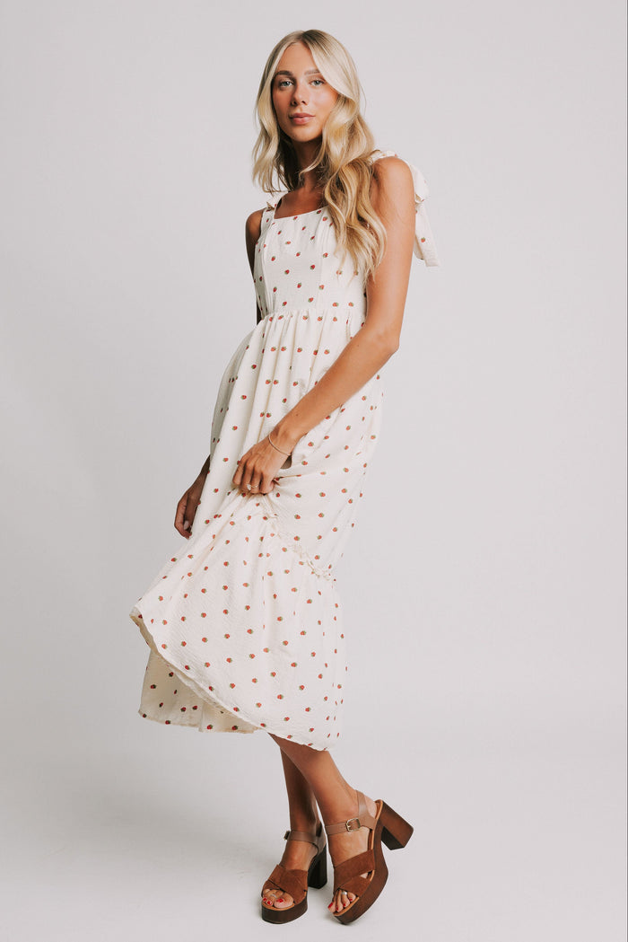 cream midi dress with strawberry print and bows on shoulders full
