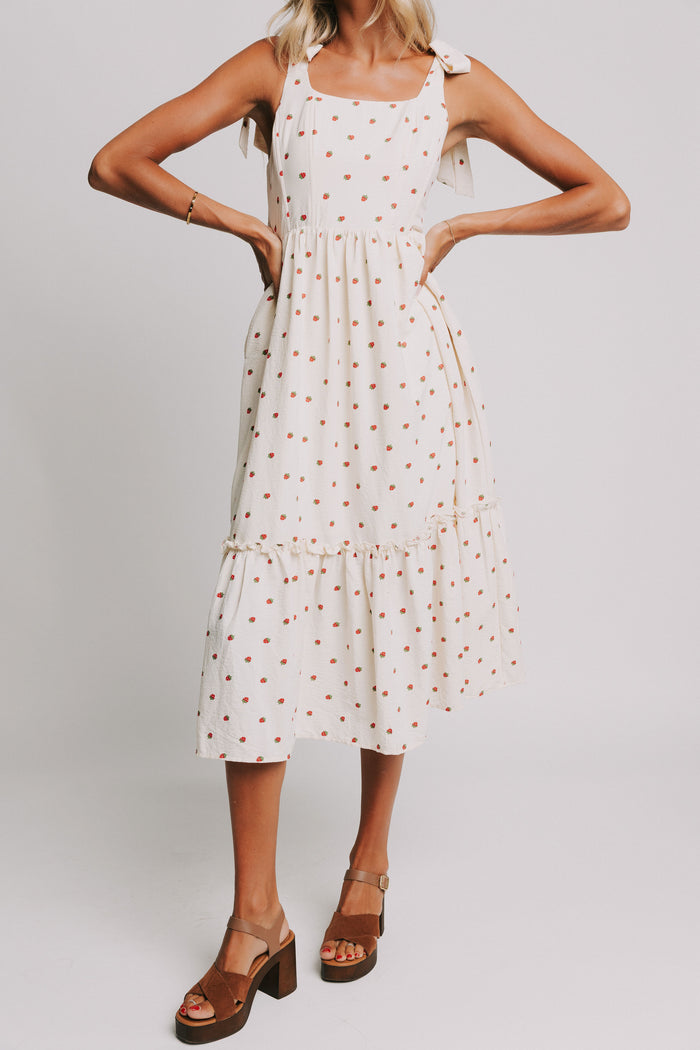 cream midi dress with strawberry print and bows on shoulders front