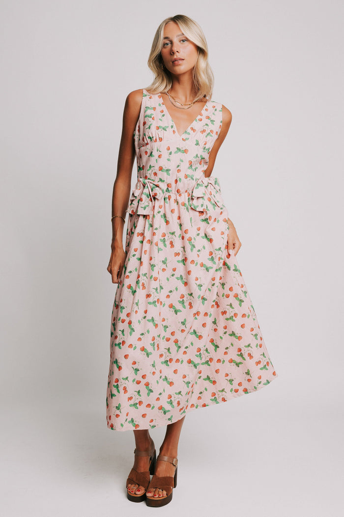 pink v neck maxi dress with strawberry print and bow details