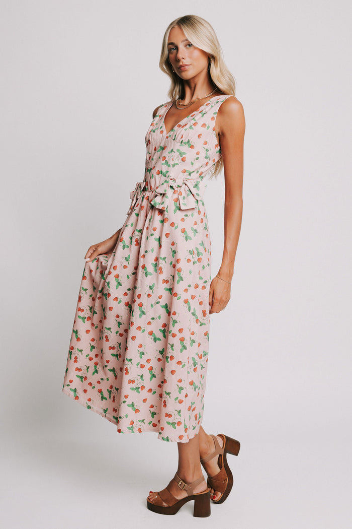 pink v neck maxi dress with strawberry print and bow details side