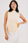 yellow sleeveless top with side twist