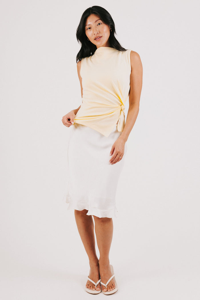 yellow sleeveless top with side twist full