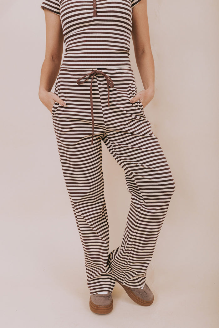 Striped wide leg lounge pants with an elastic waistband and tied bow