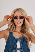 gold rimmed geometric sunglasses