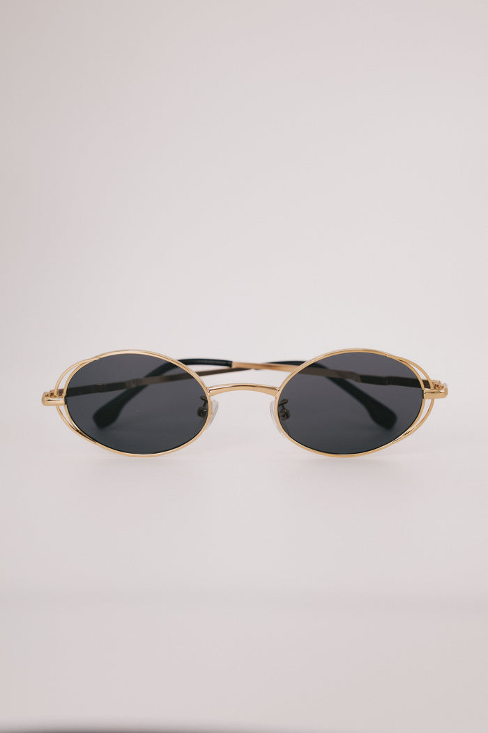 gold rimmed geometric sunglasses