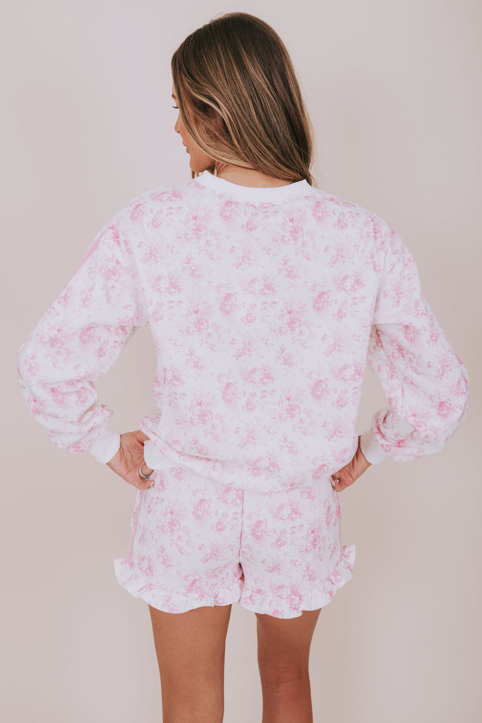 pink floral and white sweatshirt back
