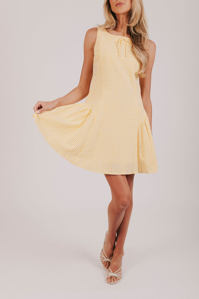 Yellow and white gingham sleeveless mini dress with tied bow and basque waist