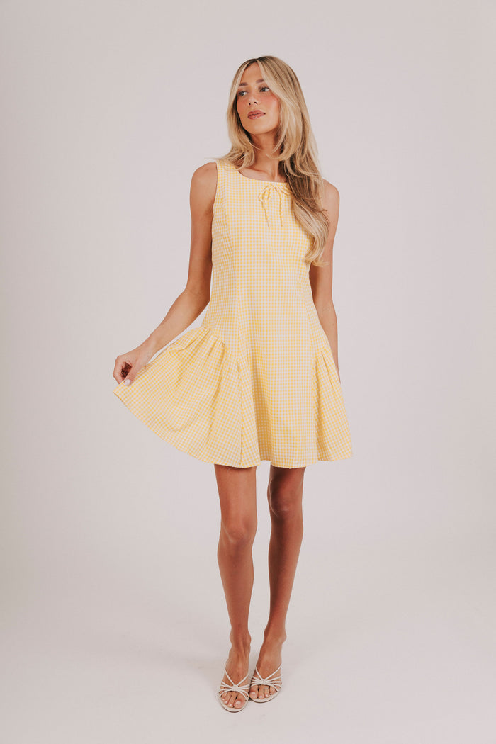 Yellow and white gingham sleeveless mini dress with tied bow and basque waist