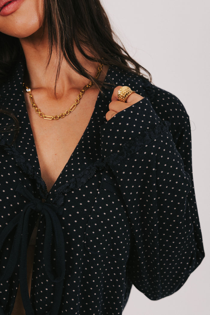 polka dot long sleeve top with bows and ruffled trim close