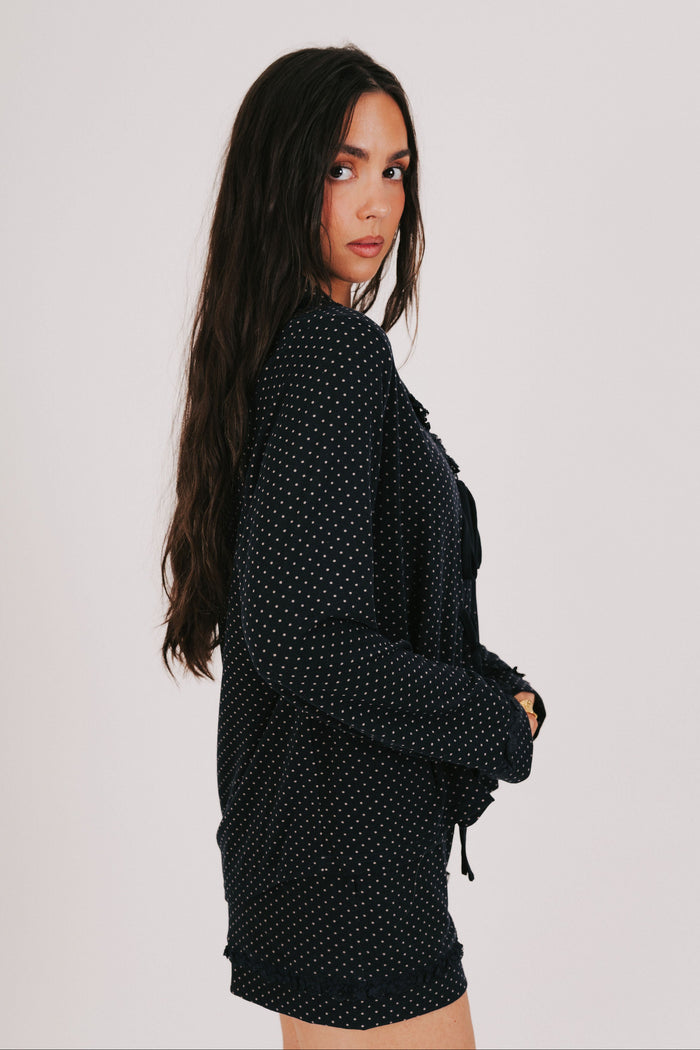 polka dot long sleeve top with bows and ruffled trim side