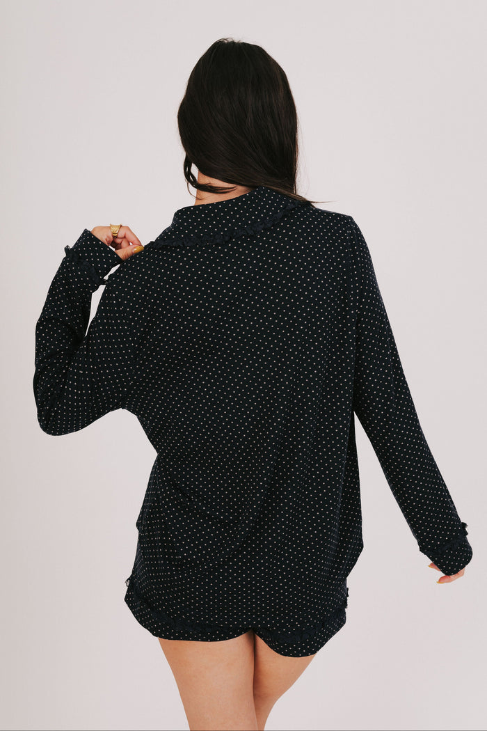 polka dot long sleeve top with bows and ruffled trim back