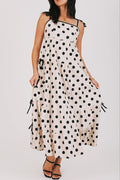 cream and black polka dot dress with bow details