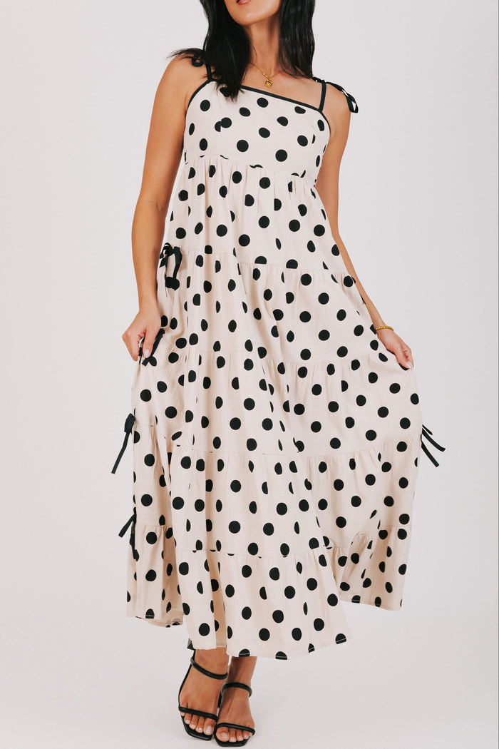 cream and black polka dot dress with bow details