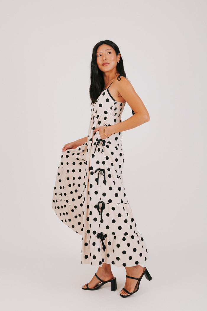 cream and black polka dot dress with bow details side