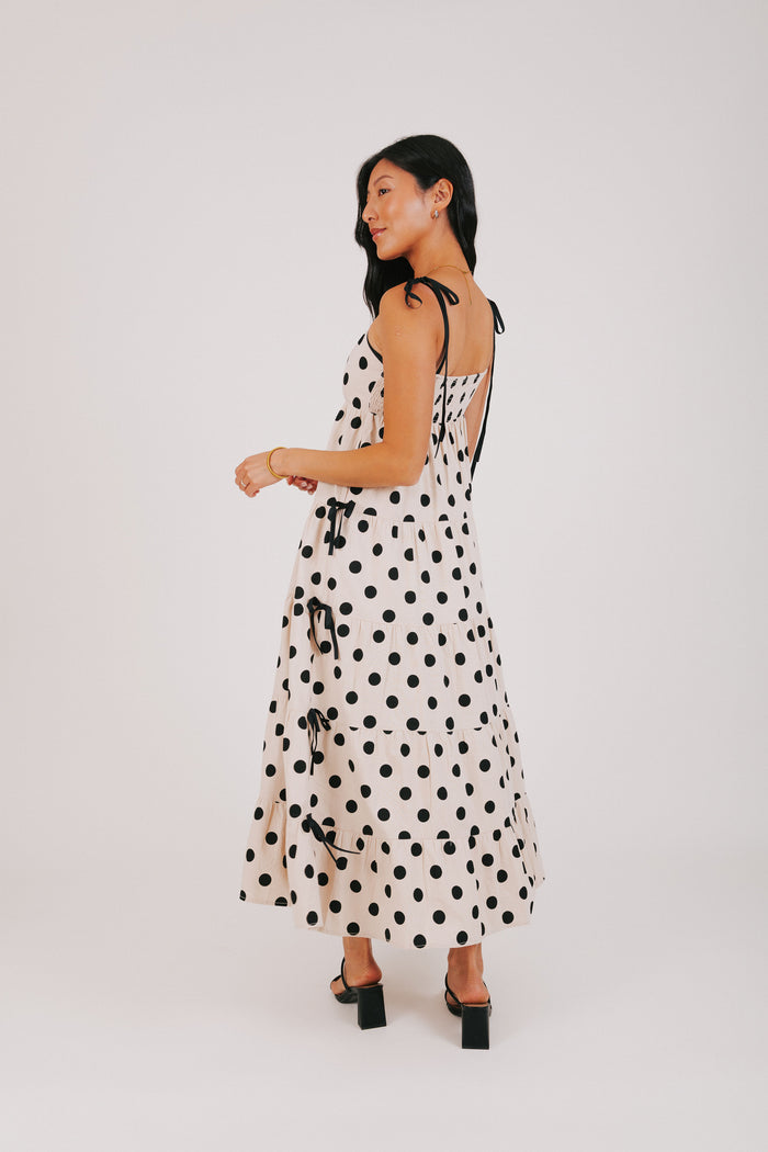 cream and black polka dot dress with bow details back