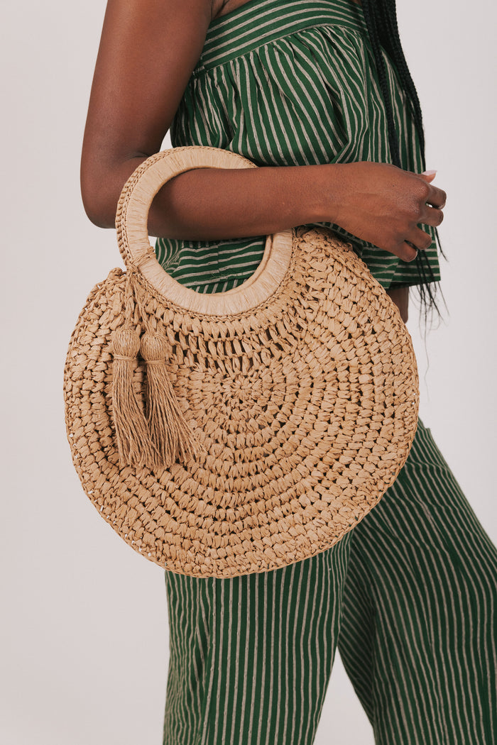 circular woven bag with tassels
