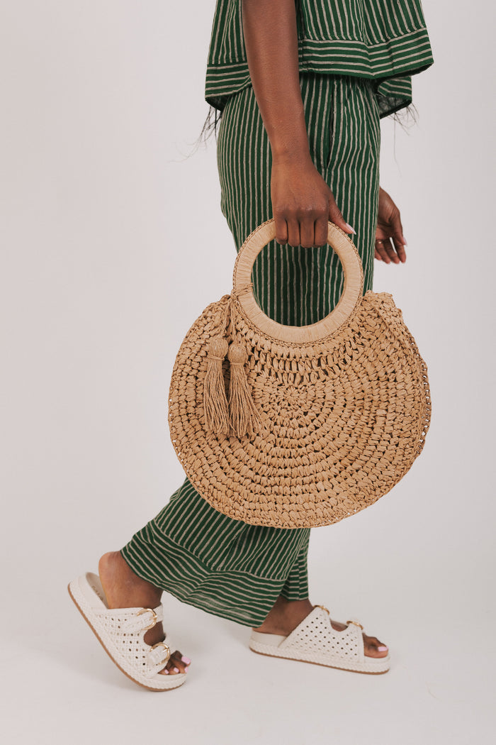 circular woven bag with tassels