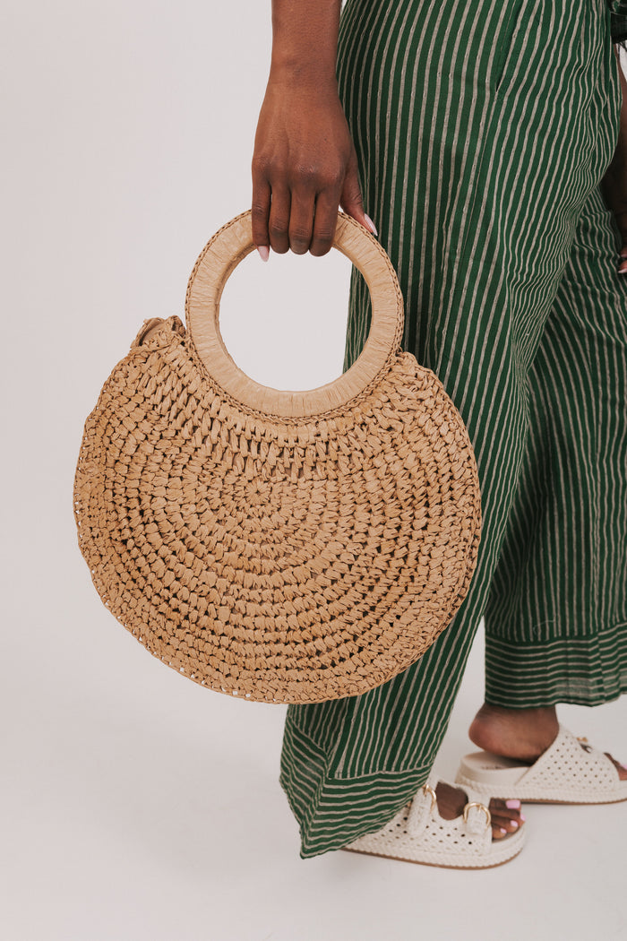 circular woven bag with tassels