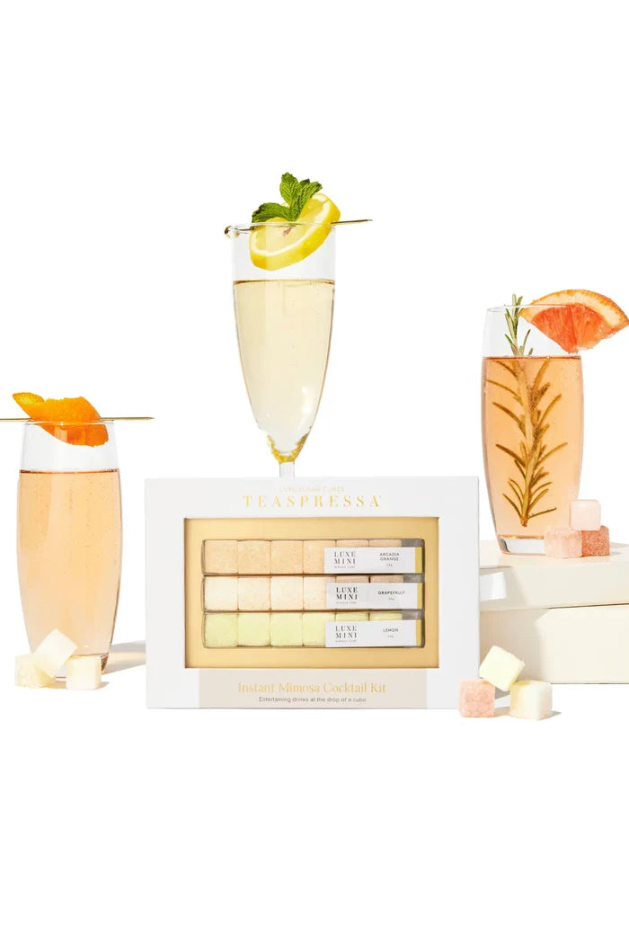 Luxe mini flavored sugar cubes for instant mimosas and their corresponding drinks