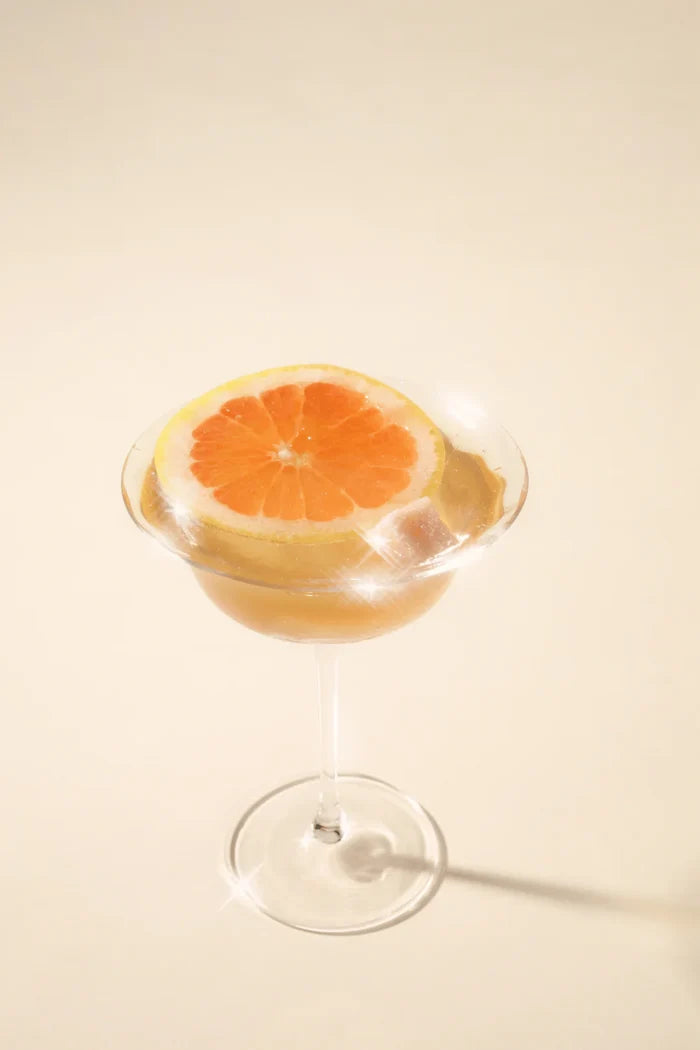 An orange mimosa made with teaspressa luxe sugar cubes.