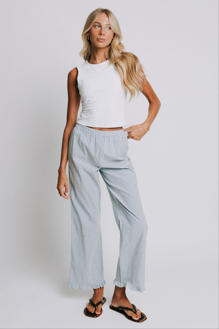 blue and white striped pants with elastic waist and ruffled hem