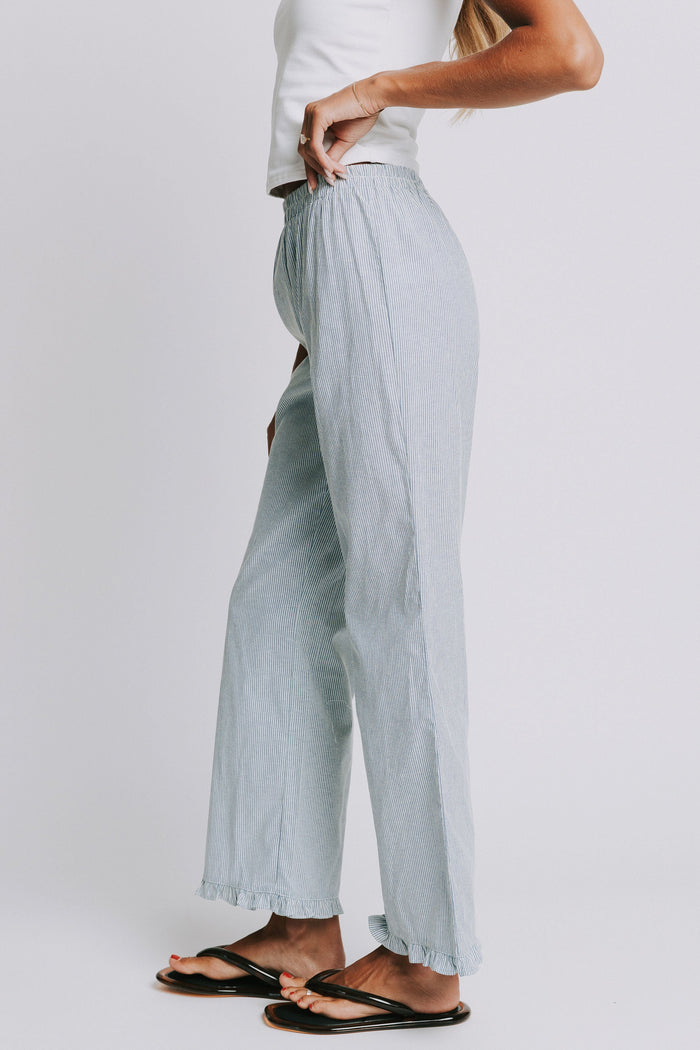 blue and white striped pants with elastic waist and ruffled hem