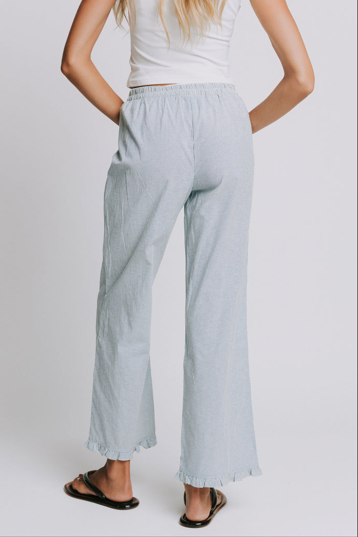 blue and white striped pants with elastic waist and ruffled hem back
