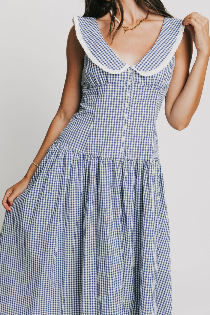 sleeveless blue and white gingham drop waist dress with collar