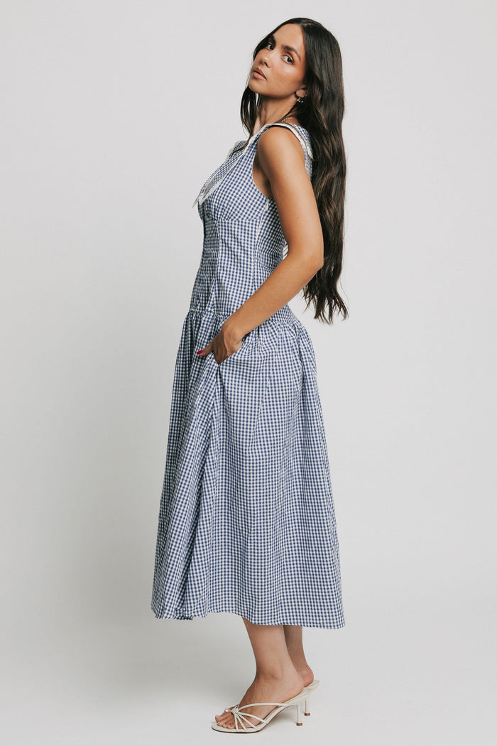 sleeveless blue and white gingham drop waist dress with collar