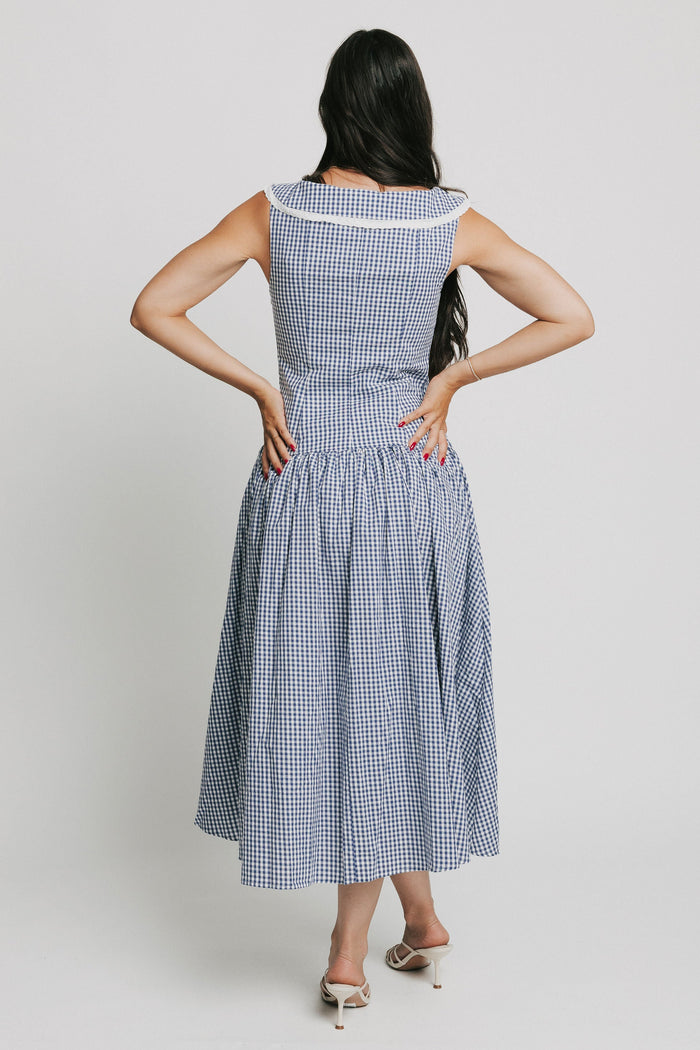 sleeveless blue and white gingham drop waist dress with collar back