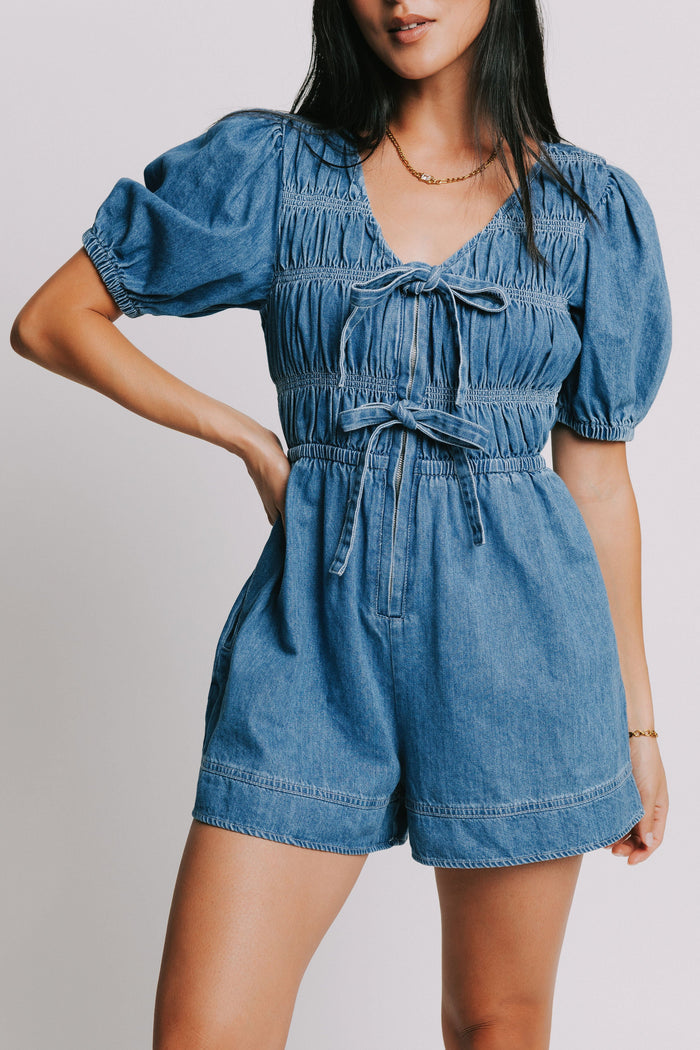 blue denim v neck romper with bows and gathered detail front