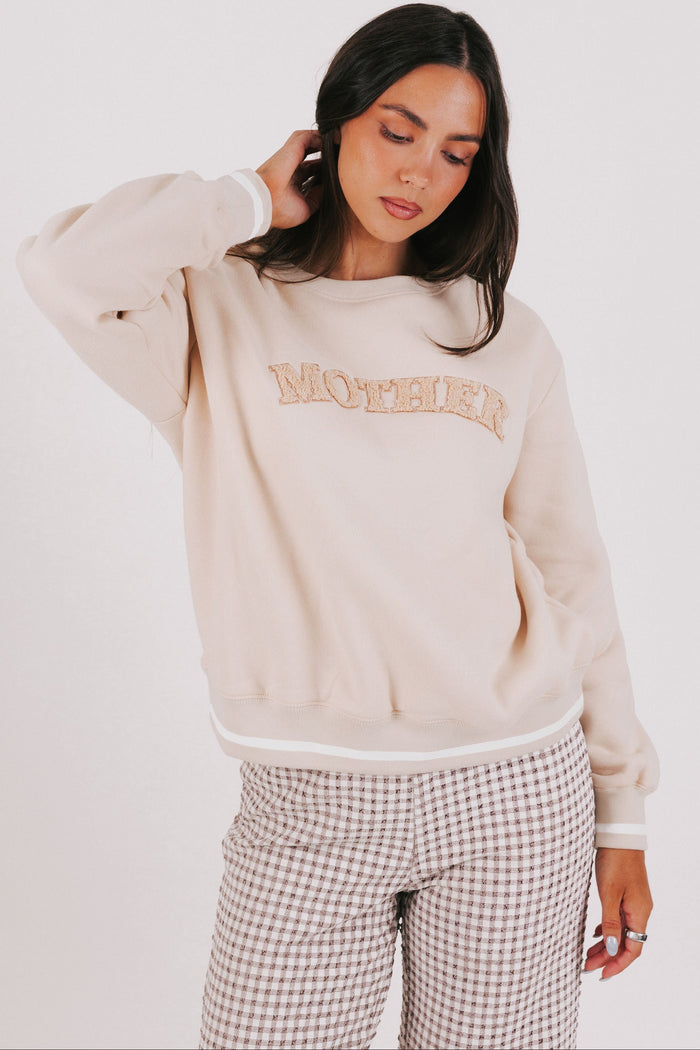 tan sweatshirt with mother printed
