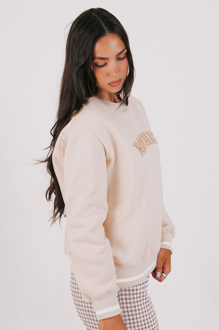 tan sweatshirt with mother printed side