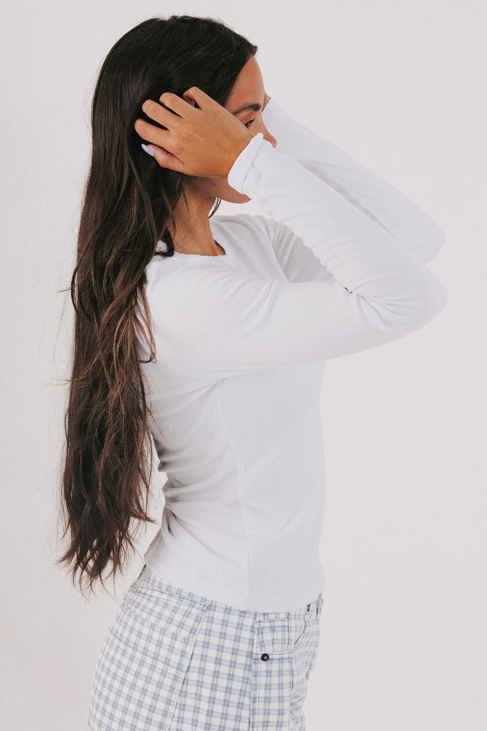 white long sleeve top with trim detail side