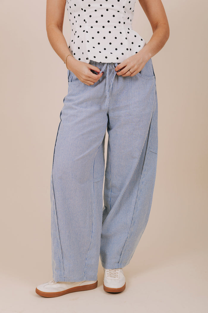 blue vertical stripe barrel cut pants front