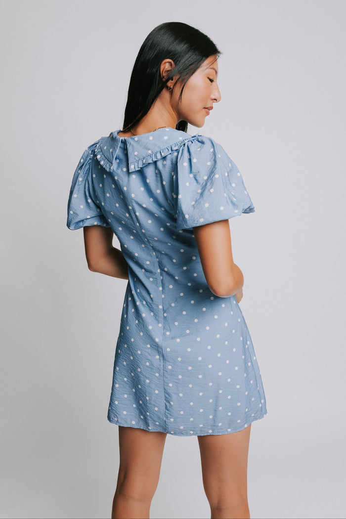 blue and white polka dot mini dress with puff sleeves and collar back