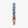 Navy floral patterned strap with brown leather end and metal clasp by Thread
