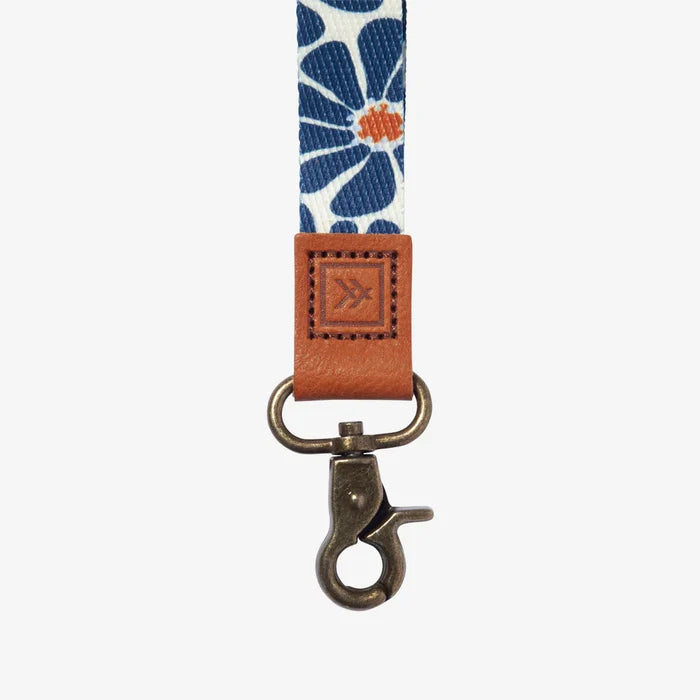 Navy floral patterned strap with brown leather end and metal clasp by Thread