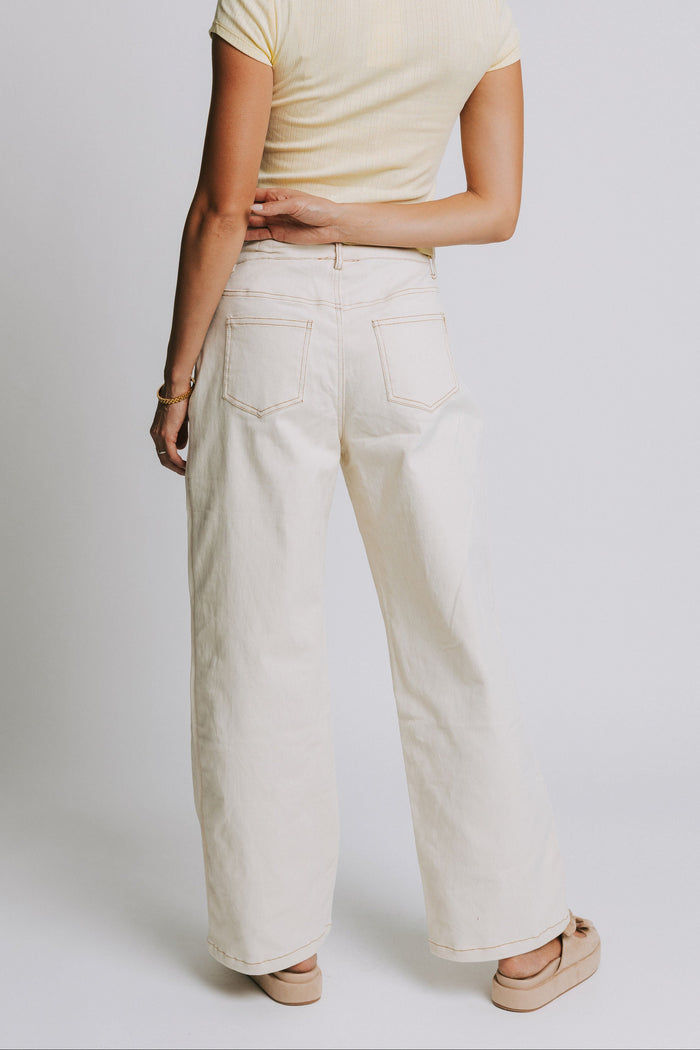 ivory jeans with tie at the waist and contrast stitching back