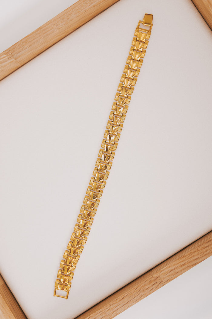 Gold plated link bracelet with texturing and hearts