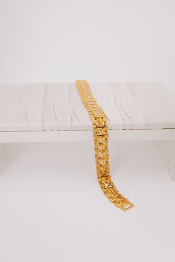 Gold plated link bracelet with texturing and hearts