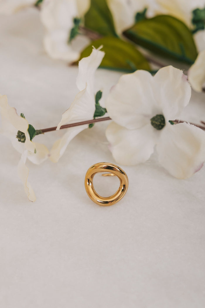Gold circle ring with cut out empty space