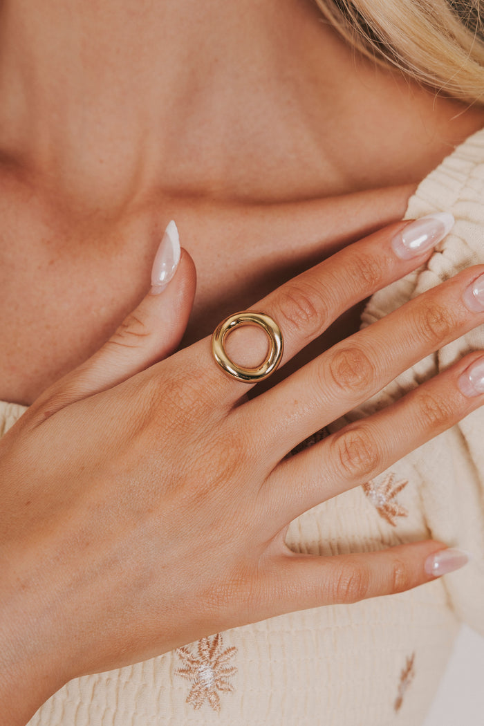 Gold circle ring with cut out empty space