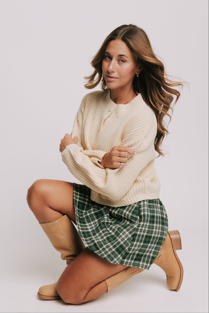 green and white plaid mini skort pose